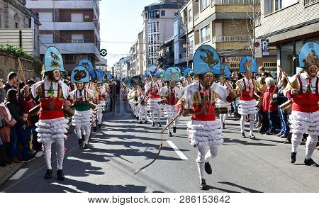 Verin, Spain, 24 Feb 2019. Famous Carnival And Street Parade With Cigarrons Costumes. Ourense Provin