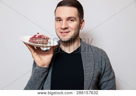 Closeup Portrait Young Cute Caucasian Man Holding White Round Plate With Piece Of Biscuit Cake, Prep