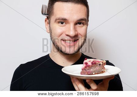 Closeup Portrait Young Cute Caucasian Man Smile, Hold White Round Plate With Piece Biscuit Cake And