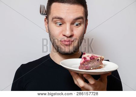 Closeup Portrait Young Cute Caucasian Man Smile, Hold White Round Plate With Piece Biscuit Cake And