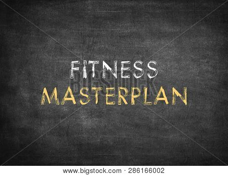 Fitness Masterplan On Chalkboard Background To Mean A Concept