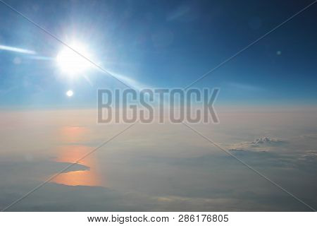 View Above The Earth At The Clouds Below