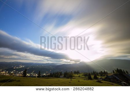 Summer Night Mountain Panorama. Green Grassy Mountain Clearing, Spruce Trees On Blue Evening Sky Cop