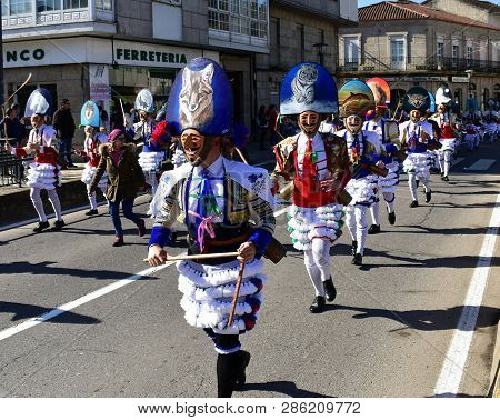 Verin, Spain, 24 Feb 2019. Famous Carnival And Street Parade With Cigarrons Costumes. Ourense Provin