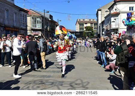 Verin, Spain, 24 Feb 2019. Famous Carnival And Street Parade With Cigarrons Costumes. Ourense Provin