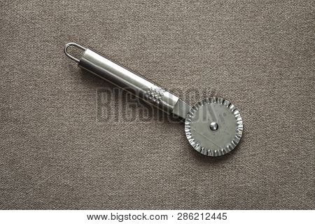 Close-up Of Sharp Stainless Steel Metal Kitchen Tool Made Of Stainless Steel Metal For Cutting Dough