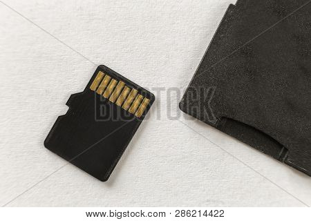Close-up Of Micro Sd Memory Card And Sd Adapter Isolated On White Copy Space Background. Modern Tech