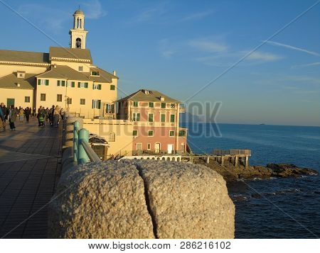 Genova, Italy - 02/14/2019: An Amazing Caption Of The Sunset Over The Sea And The City Of Genoa In W