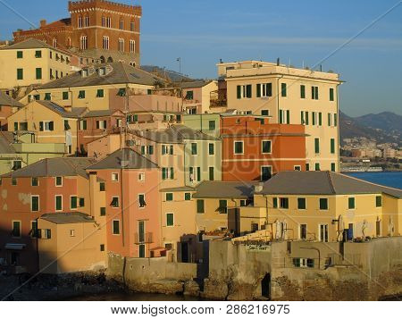 Genova, Italy - 02/14/2019: An Amazing Caption Of The Sunset Over The Sea And The City Of Genoa In W