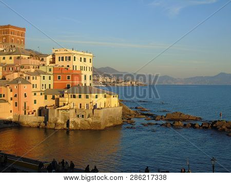 Genova, Italy - 02/14/2019: An Amazing Caption Of The Sunset Over The Sea And The City Of Genoa In W