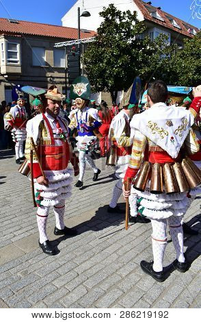 Verin, Spain, 24 Feb 2019. Famous Carnival And Street Parade With Cigarrons Costumes. Ourense Provin