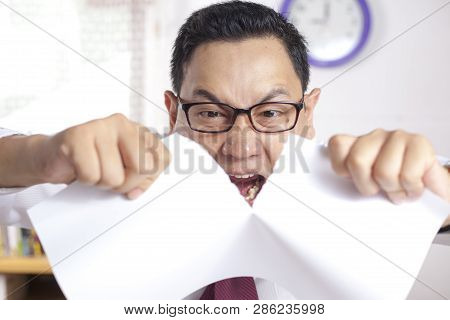 Angry Businessman Rip Off Contract Paper