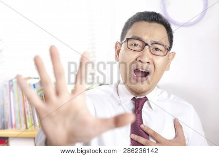 Muslim Businessman Shows Stop Gesture
