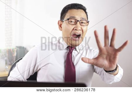 Muslim Businessman Shows Stop Gesture