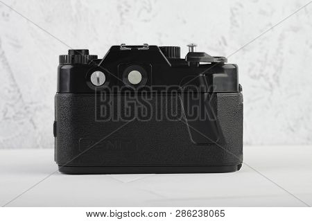 Moscow, Russia, February 26, 2019. The Old Soviet 35 Mm Slr Camera Zenit 122, Released 1993, On Gray
