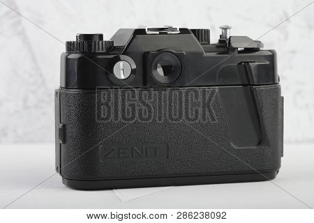 Moscow, Russia, February 26, 2019. The Old Soviet 35 Mm Slr Camera Zenit 122, Released 1993, On Gray