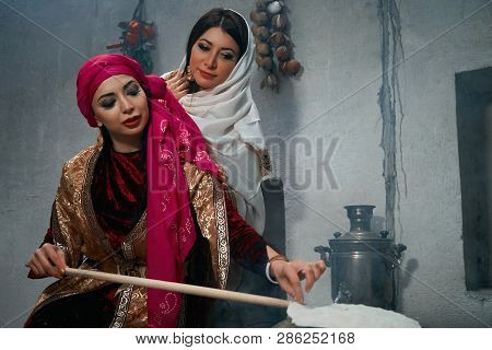 Woman Preparing Or Making Borek Or Bread Dough On Fire