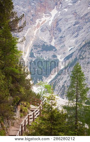 Wooden Stairs In The Mountains With Mudflow On Background