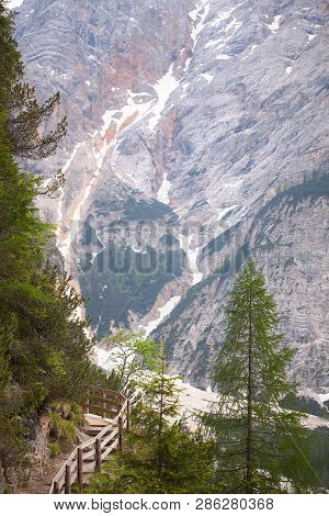 Wooden Stairs In The Mountains With Mudflow On Background