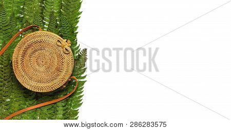 Fashionable Handmade Natural Organic Rattan Bag And Green Fern Leaves, Pink Flower Isolated On White
