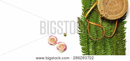 Fashionable Handmade Natural Organic Rattan Bag And Green Fern Leaves, Pink Flower Isolated On White