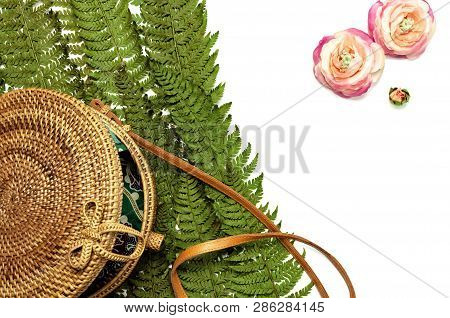Fashionable Handmade Natural Organic Rattan Bag And Green Fern Leaves, Pink Flower Isolated On White