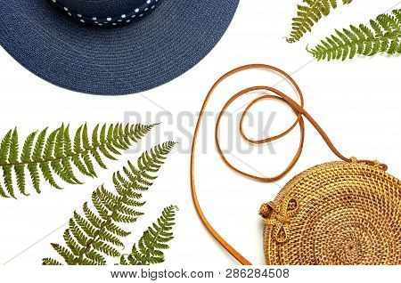 Fashionable Handmade Natural Organic Rattan Bag, Hat And Green Fern Leaves, Pink Flower Isolated On