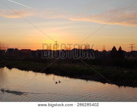 Sunset Over The Ring Canal Along The Bermweg In Nieuwerkerk Aan Den Ijssel In The Netherlands
