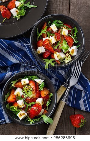 Vegetarian Salad With Strawberry, Tofu And Aragula On Wooden Background Overhead Shot, Summer Lunch 