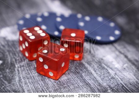 Red Dice And Casino Gaming Chips On Vintage Wooden Table. Background For Casino Games, Gambling, Luc