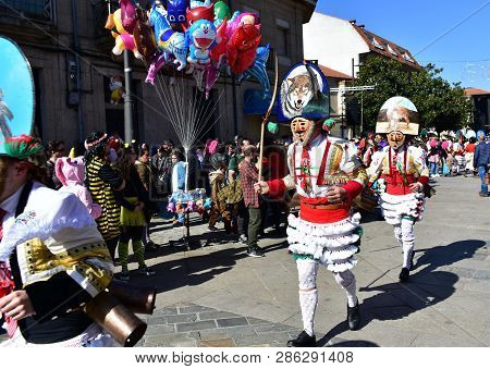 Verin, Spain, 24 Feb 2019. Famous Carnival And Street Parade With Cigarrons Costumes. Ourense Provin