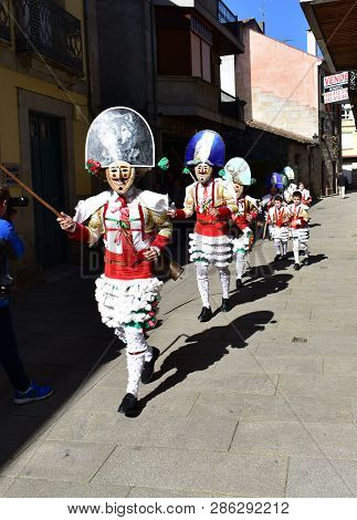 Verin, Spain, 24 Feb 2019. Famous Carnival And Street Parade With Cigarrons Costumes. Ourense Provin