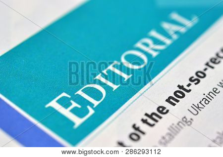 Heading A Editorial In The Newpaper. Concept Editorial. Shallow Dof.