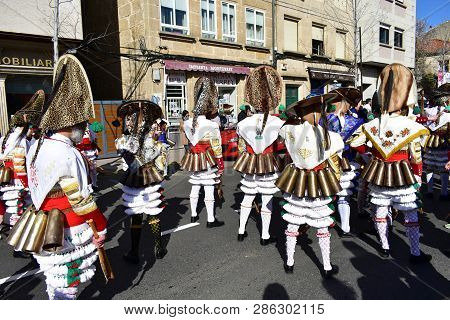 Verin, Spain, 24 Feb 2019. Famous Carnival And Street Parade With Cigarrons Costumes. Ourense Provin