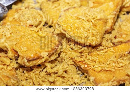Traditional Asian Freshly Fried Puff Pastries In A Street Vending Tray. Close-up