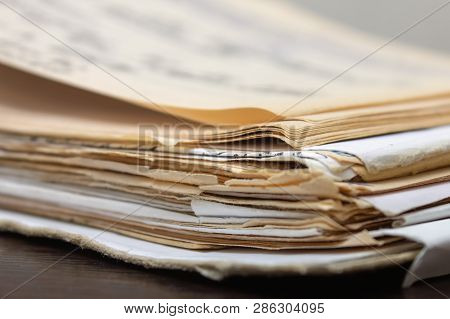 A Pile Of Old Paper Documents. Folder With Yellowed Papers. Yellowed Old Documents. Old Book. Old Ma