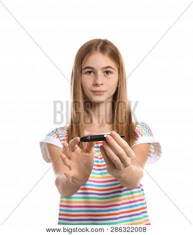 Teen Girl Using Lancet Pen On White Background. Diabetes Control