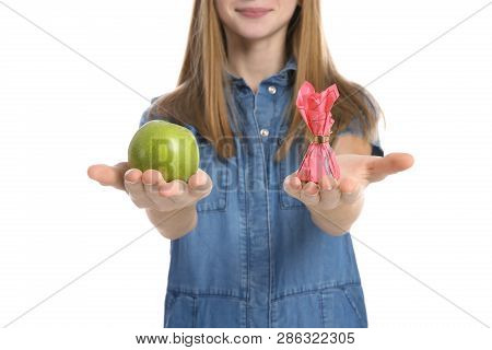 Teen Girl With Apple And Candy On White Background, Closeup. Diabetes Diet