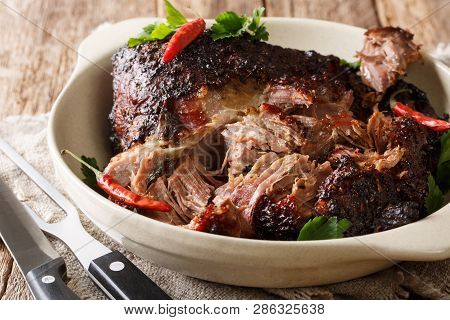 Puerto Rican Pernil Asado Shredded Pork Close-up On A Plate. Horizontal