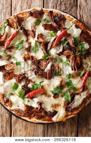 Spicy Pulled Pork Pizza With Mozzarella Cheese, Herbs And Barbecue Sauce Close-up. Vertical Top View