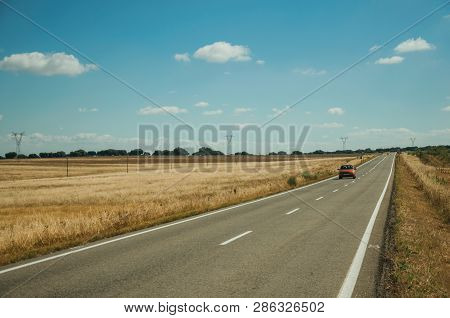 Road Through Rural Landscape And Car Near The Monfrague National Park