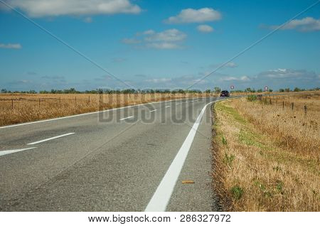Road Through Rural Landscape And Car Near The Monfrague National Park
