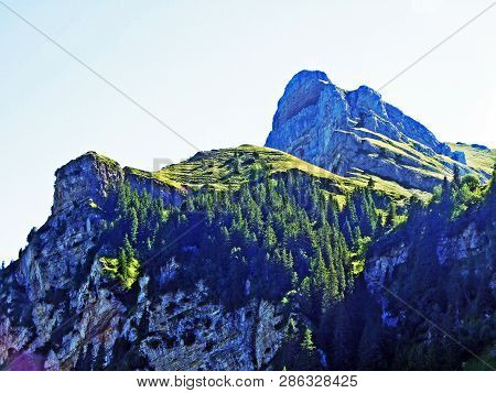 Mountain Hikers On The Alpine Peak Of Margelchopf And In The Alviergruppe Mountain Range - Canton Of