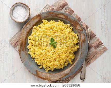 Bulgur Wheat. Boiled Bulghur Cereal In Plate On White Wooden Table. Healthy Vegetarian Food, Top Vie