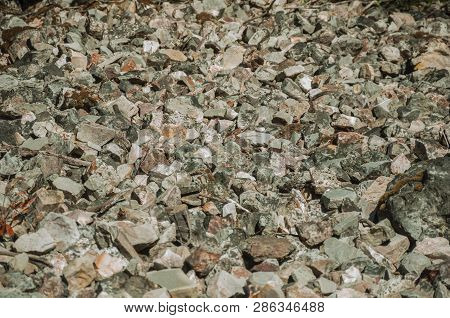 Close-up Of A Bunch Of Rough Stones Lying On The Slope At The Monfrague National Park. A Remarkable 