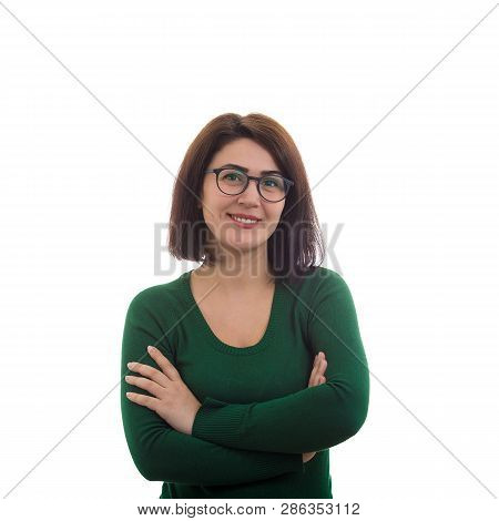 Casual Young Woman Wearing Glasses, Arms Crossed, Smiling Broadly To Camera Isolated Over White Back