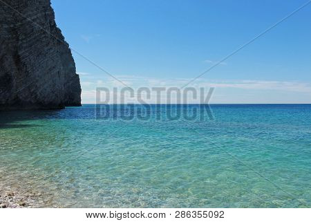 Rocks On Island Of St. Nicholas In Budva, Montenegro. Paradise Beach On Island In Sea. Travel Concep