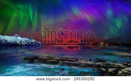 Beautiful northern lights of the northern part of the planet. Magnificent views of the ocean and northern lights with rocks and stones. Beautiful sea water plays with colors and light