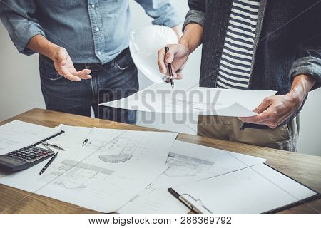 Architecture Engineer Teamwork Meeting, Drawing And Working For Architectural Project And Engineerin