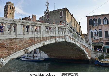 Venice, Italy - August 10, 2014: People At The Guglie Bridge,  Over The Cannaregio Canal In Venice, 